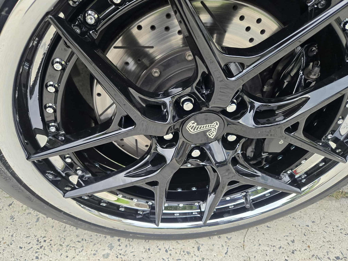 Custom forged black and chrome rims on a 2011 Ford Shelby GT500, showcasing RVRN RV-DR08D series wheels.