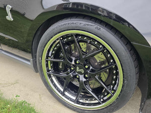 2011 Ford Shelby GT500 with custom forged black and chrome RVRN RV-DR08D series wheels close-up.