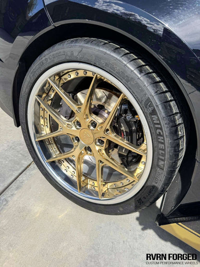 Close-up of a 2020 Corvette C8 Z51 featuring stylish RVRN gold and chrome aftermarket wheels.