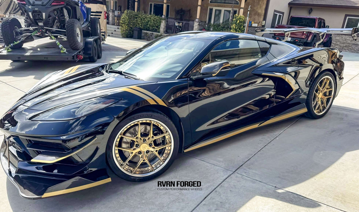 2020 Corvette C8 Z51 with gold and chrome RVRN aftermarket wheels parked outdoors.