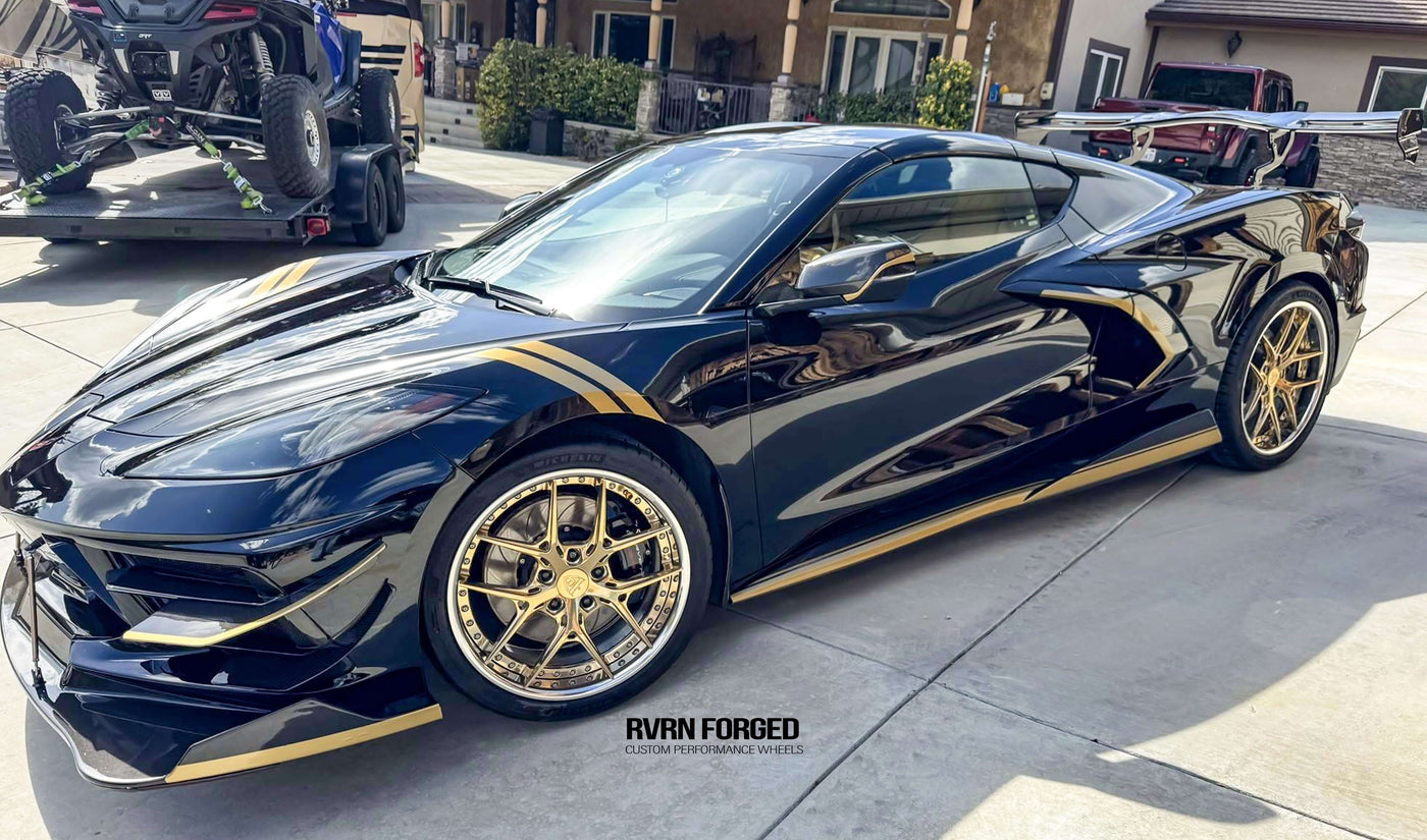 2020 Corvette C8 Z51 with gold and chrome RVRN aftermarket wheels parked outdoors.