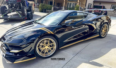 2020 Corvette C8 Z51 with gold and chrome RVRN aftermarket wheels parked outdoors.