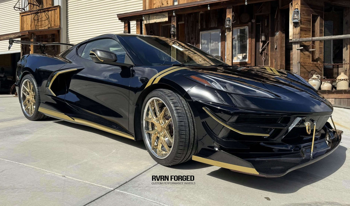 2020 Corvette C8 Z51 with gold rims, showcasing RVRN aftermarket wheels and chrome accents against a sleek black exterior.