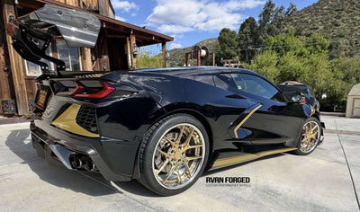 2020 Corvette C8 Z51 showcasing gold RVRN aftermarket wheels in a scenic outdoor setting.