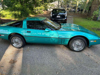 Side view of 1990 Corvette C4 featuring DR90 deep dish wire wheels in chrome, 17x9.5, highlighting classic styling and aggressive stance.