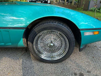Front angle of 1990 Corvette C4 on RVRN DR90 chrome deep dish wire wheels, 17x9.5 with 2-blade caps, showcasing vintage design with modern forged quality.