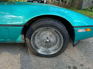 Front angle of 1990 Corvette C4 on RVRN DR90 chrome deep dish wire wheels, 17x9.5 with 2-blade caps, showcasing vintage design with modern forged quality.