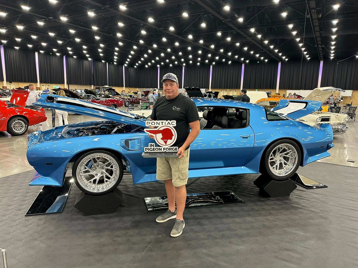 RVRN Wheels customers showcase custom forged wheels at a car show with a blue Pontiac and proud owner.