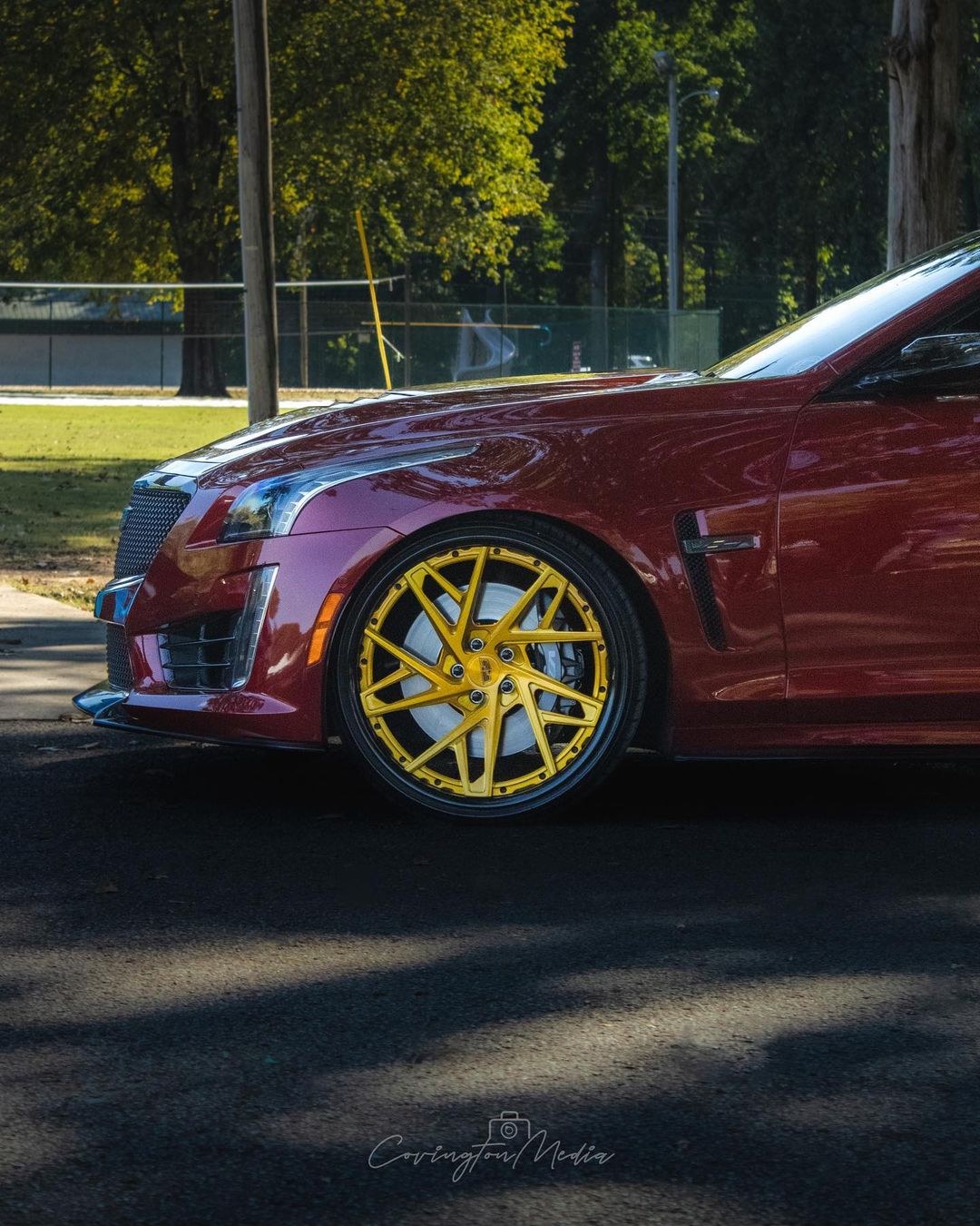 Custom Cadillac CTS-V with RVRN Forged 22-inch luxury performance wheels and deep dish yellow rims.