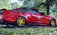 Cadillac CTS-V with custom RVRN Forged 22-inch deep dish wheels, showcasing luxury performance and style in a vibrant red finish.