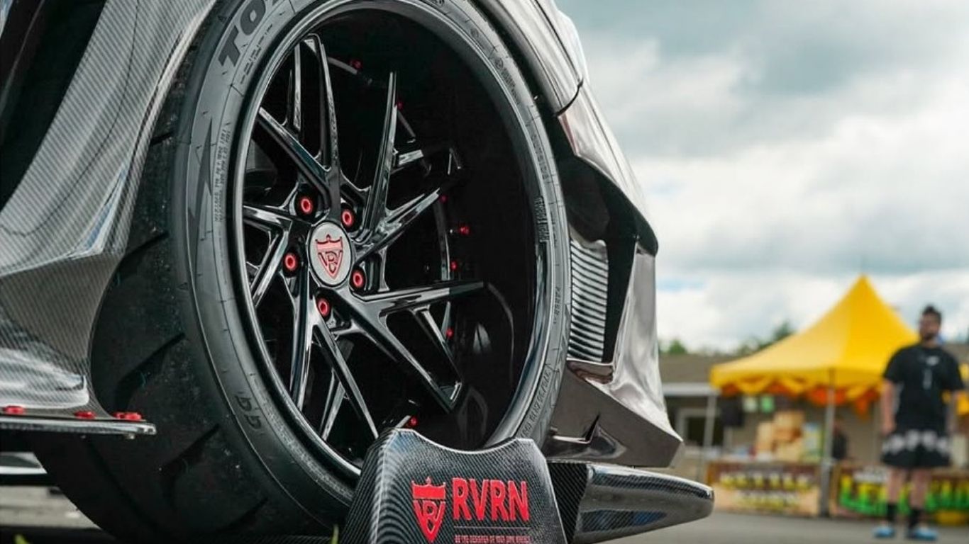 Side profile of black 2017 Subaru WRX STI showcasing deep dish 19" custom wheels.