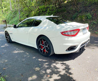 2018 Maserati Granturismo with custom 20-inch staggered RVRN forged RV-DV03 Series wheels on a scenic road.