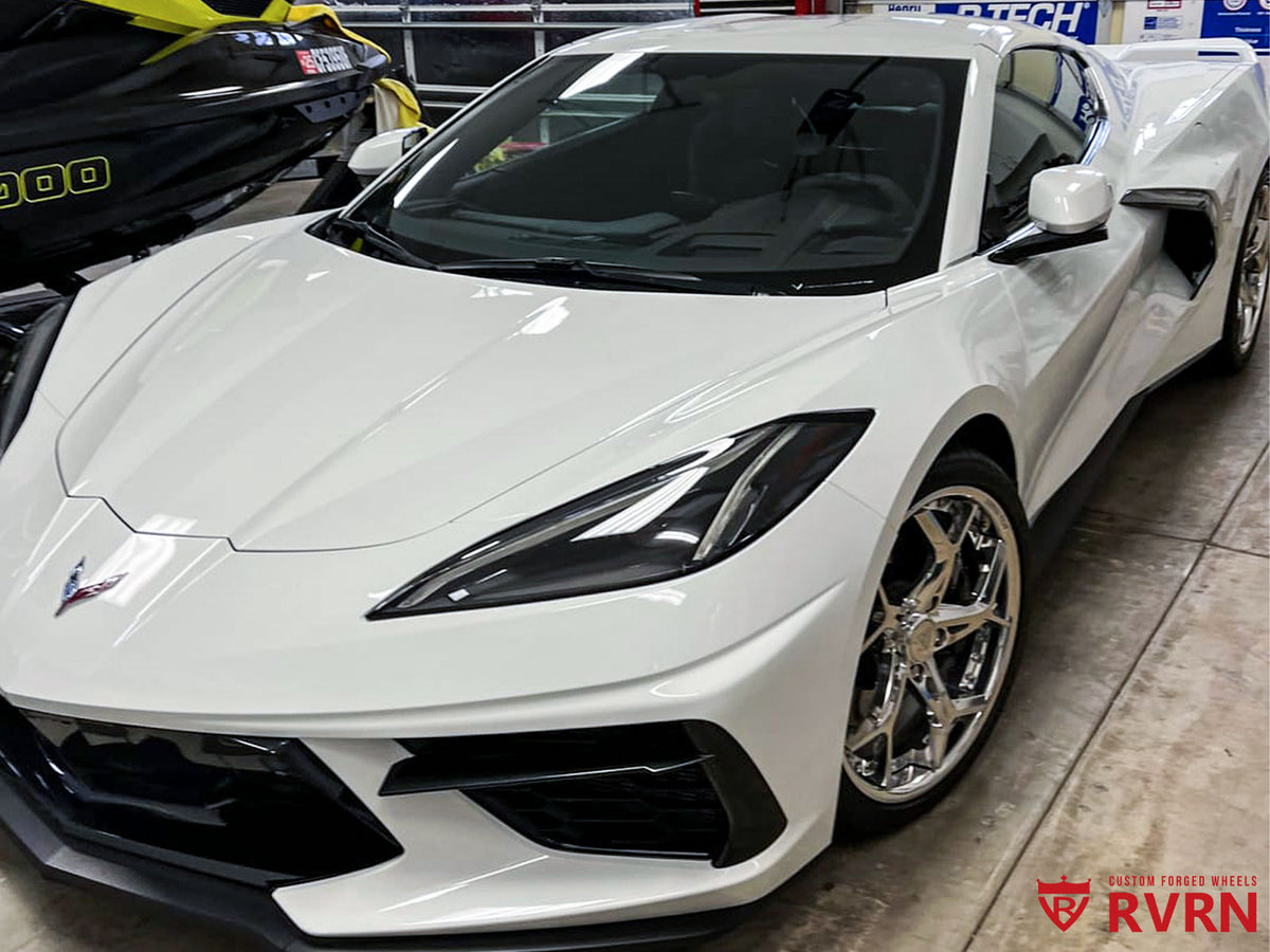 2023 Corvette C8 Stingray Z51 featuring custom RVRN aftermarket wheels, showcasing a sleek white exterior.