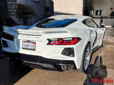 2023 Corvette C8 Stingray Z51 with custom RVRN wheels parked in a driveway, showcasing sleek design and aftermarket enhancements.