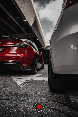 Side profile of Tesla Model Y showing 20x9.5 forged performance wheels, best aftermarket wheel upgrade