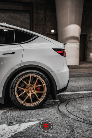 Front angle showing Tesla Model Y performance wheels, 20x9.5 forged custom design
