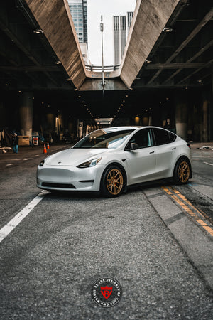 Brake clearance view of 20x9.5 custom forged wheels on Tesla Model Y