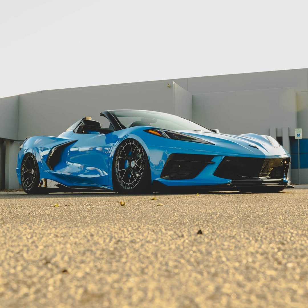 C8 Corvette with aftermarket carbon flash metallic rims, showcasing Z51 wheels in a striking blue color.