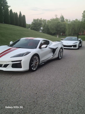 2025 Corvette C8 E-Ray with polished aluminum custom wheels parked on a driveway, showcasing forged performance rims.