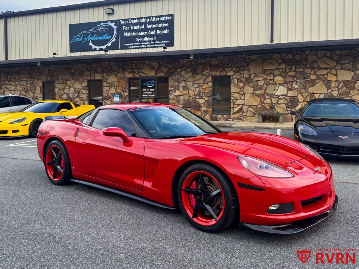 Front three-quarter view of a red 2008 Corvette C6 on RVRN RV-MC35 5-spoke wheels with gloss black spokes and red barrels