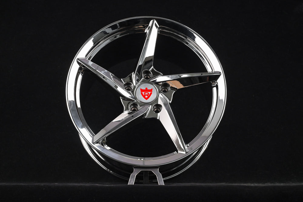 5 spoke chrome rim for Porsche 911, showcasing sleek design ideal for aftermarket customization.