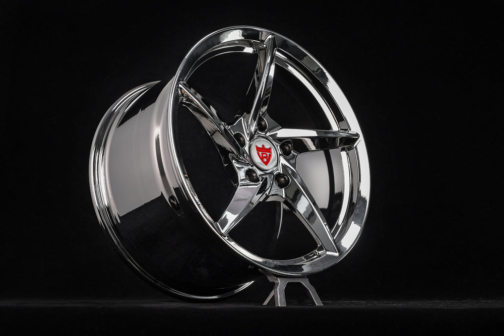 Aftermarket 5 spoke chrome rim for Porsche 911, enhancing style and performance with sleek design.