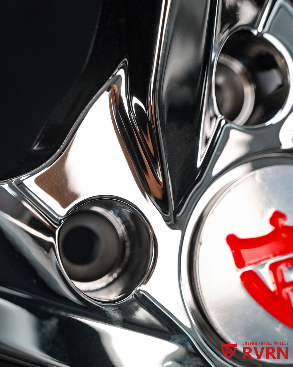 Close-up of aftermarket 5 spoke chrome rims for Porsche 911 showcasing precision design and quality craftsmanship.