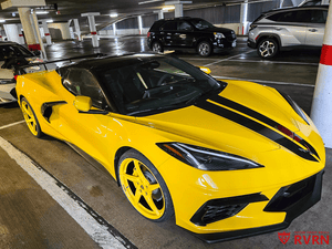 Rear fitment of black aftermarket wheels on yellow Corvette C8 Stingray, 21x12 forged wheels for aggressive performance stance
