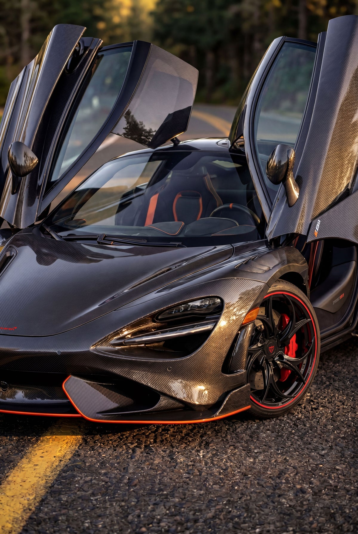 McLaren 720S side view showing OEM+ Y-Spoke Satin Black wheel integration.