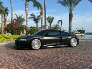 Front three-quarter view of a matte black 2017 Audi R8 on RVRN RV-MD02 brushed aluminum custom forged wheels in a driveway