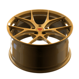 Custom forged monoblock performance wheel in gold finish, designed for Ferrari California and other vehicles.