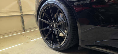 Close-up of 2022 Audi E-Tron GT featuring sleek custom forged super concave black wheels.