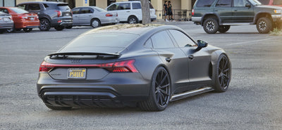 2022 Audi E-Tron GT with super concave custom forged wheels parked in a lot.