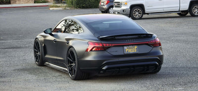 2022 Audi E-Tron GT with custom forged super concave wheels, showcasing an elegant rear view in a parking lot.