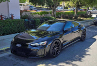 2022 Audi E-Tron GT showcasing custom forged wheels with super concave design, parked in a sunny urban setting.