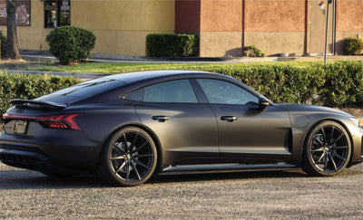 2022 Audi E-Tron GT in matte black finish with super concave custom forged wheels, showcasing elegant design and performance.