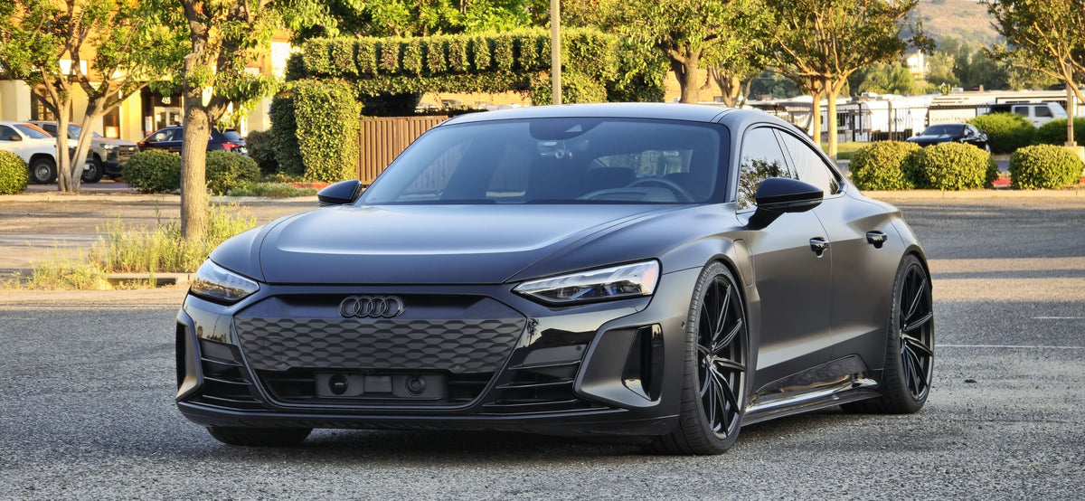 2022 Audi E-Tron GT with custom forged super concave wheels, showcasing sleek black design and luxury style.