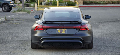 Rear view of a 2022 Audi E-Tron GT showcasing custom forged wheels and sleek design.