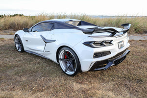 2023 Corvette C8 Z06 with custom concave carbon flash wheels on a scenic background.