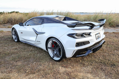 2023 Corvette C8 Z06 with custom concave carbon flash wheels on a scenic background.