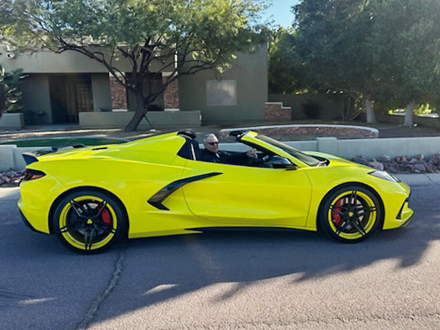 Front angle of 2023 Corvette C8 Stingray featuring RVRN MR02 5-star wheels, 19x8.5 / 20x11 setup, Accelerated Yellow accents with black spokes, installed for track-ready style.