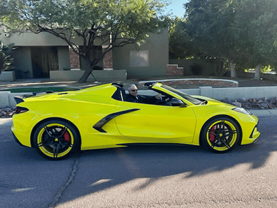 Front angle of 2023 Corvette C8 Stingray featuring RVRN MR02 5-star wheels, 19x8.5 / 20x11 setup, Accelerated Yellow accents with black spokes, installed for track-ready style.