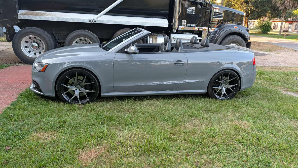 2014 Audi RS5 convertible with custom forged rvrn RV-MR05 wheels, 20x9 setup, parked on grass.