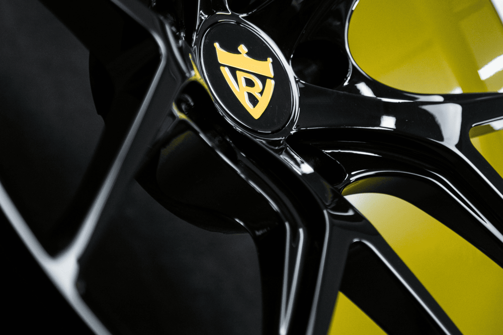Side view showing concave 20-inch black and yellow M4 wheels