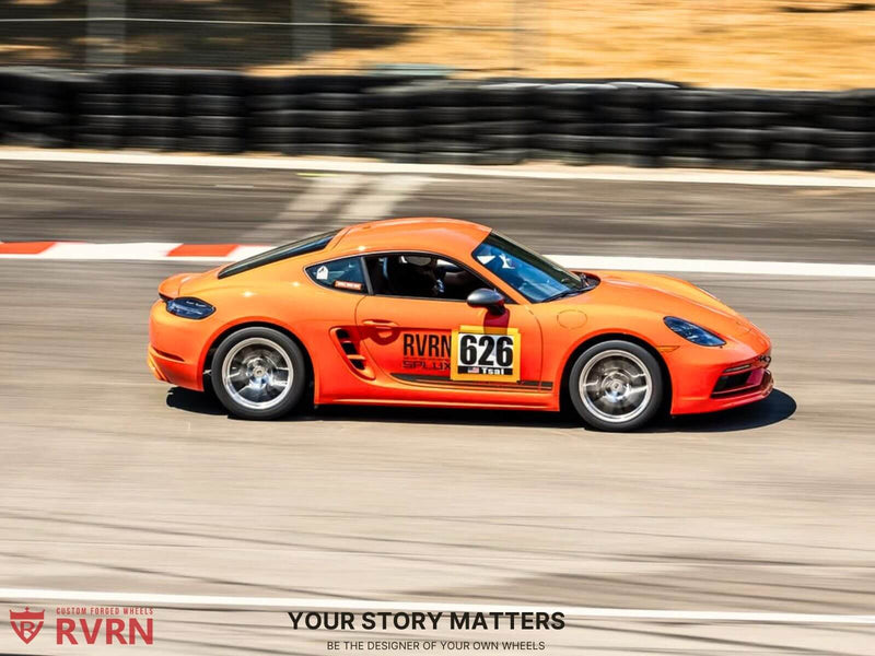Porsche Cayman T with RVRN forged wheels racing on track, showcasing lightweight aluminum custom wheels for performance.