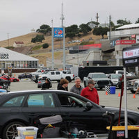 Porsche Cayman T with RVRN forged wheels at Laguna Seca 2025, showcasing performance and lightweight aluminum design.