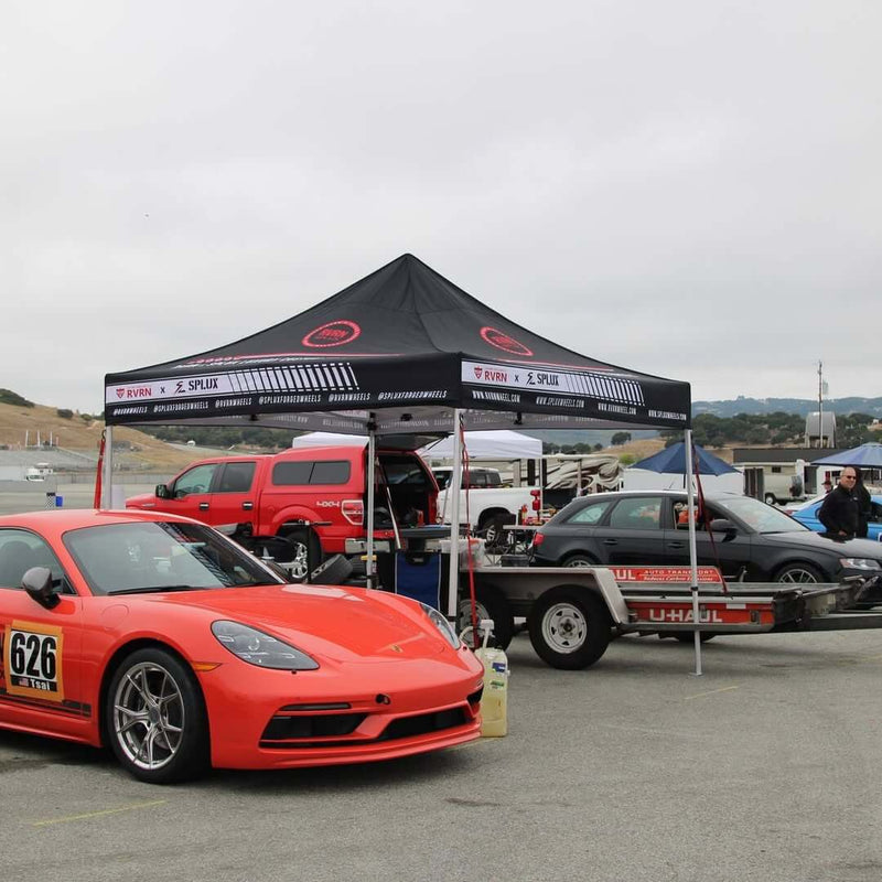 Porsche Cayman T with RVRN forged wheels at Laguna Seca 2025, showcasing custom lightweight performance wheels.
