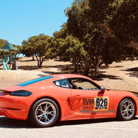 Porsche Cayman T with RVRN forged lightweight wheels, showcased at Laguna Seca 2025, designed for performance and track racing.
