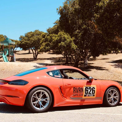 Porsche Cayman T with RVRN forged lightweight wheels, showcased at Laguna Seca 2025, designed for performance and track racing.