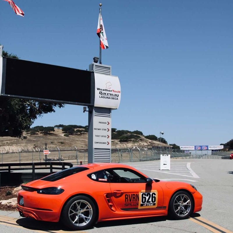 Porsche Cayman T with RVRN forged wheels at Laguna Seca 2025, showcasing custom lightweight performance wheels.